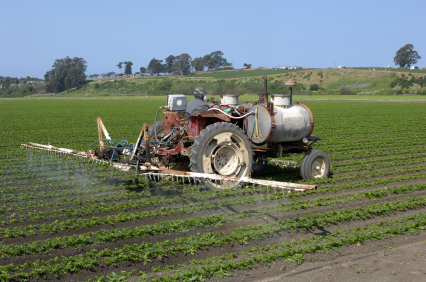 Farmer in Watsonville, California spraying crops with pesticides EPA