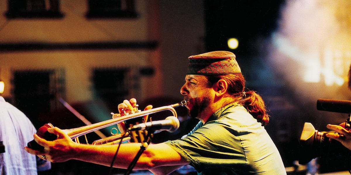 picture of Frank London playing trumpet.