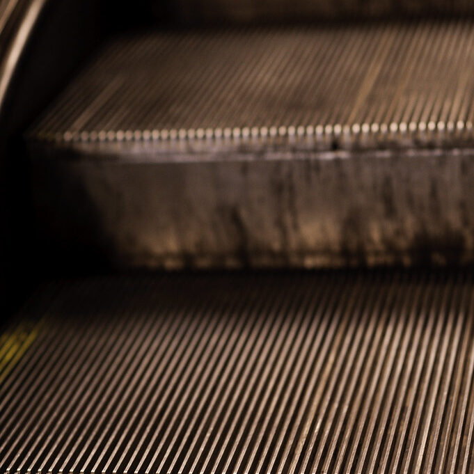 close-up image of an escalator, not a stairway